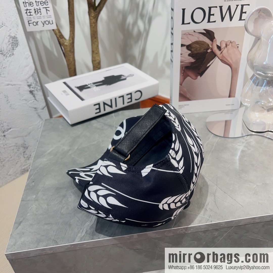Chanel color-matching black and white flower cap
