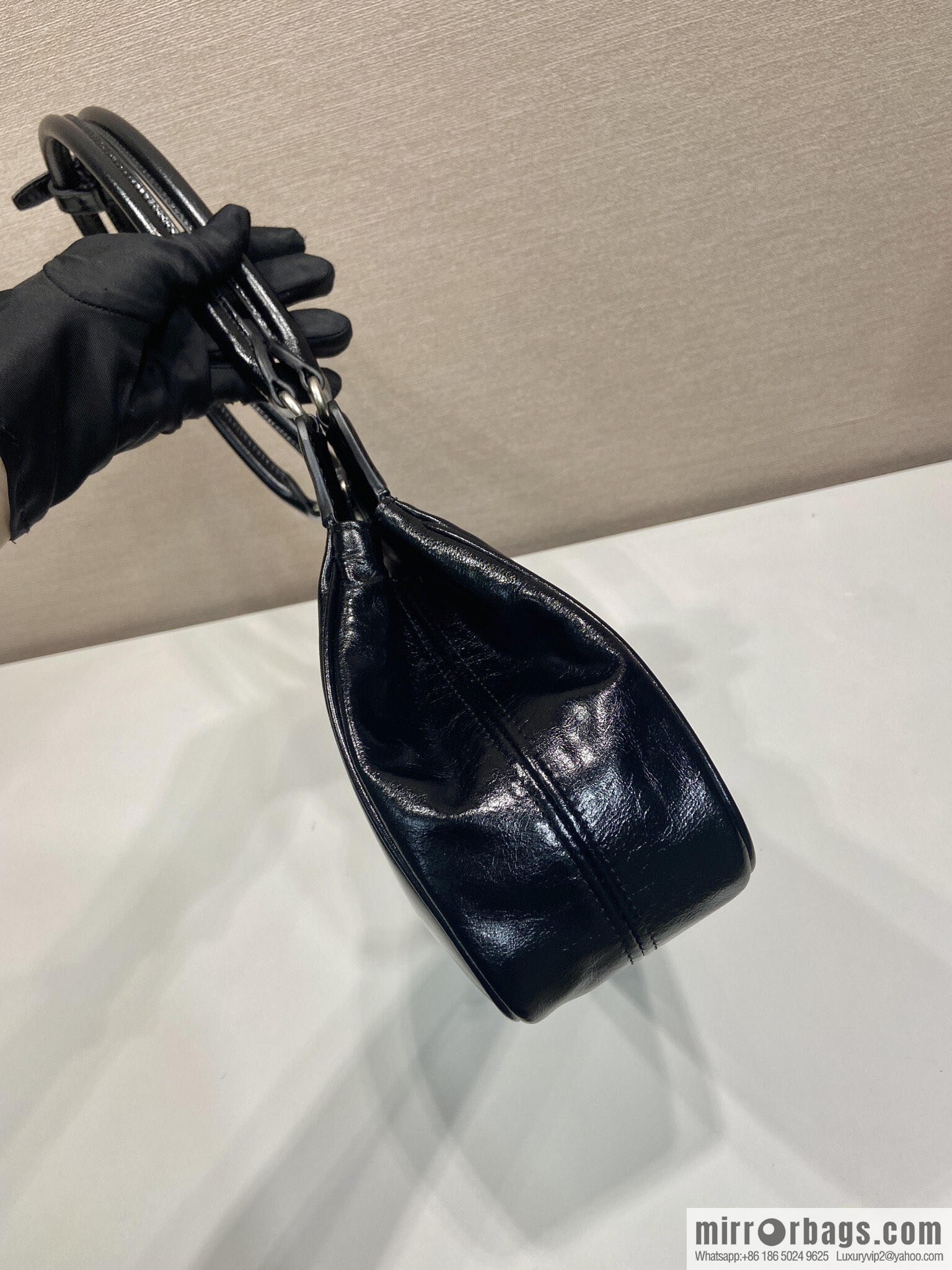 PRADA's new 1BG569 oil wax leather, black.