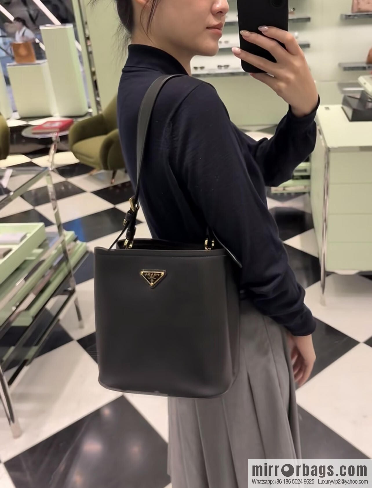 PRADA's new 1BE080 bucket bag, black.