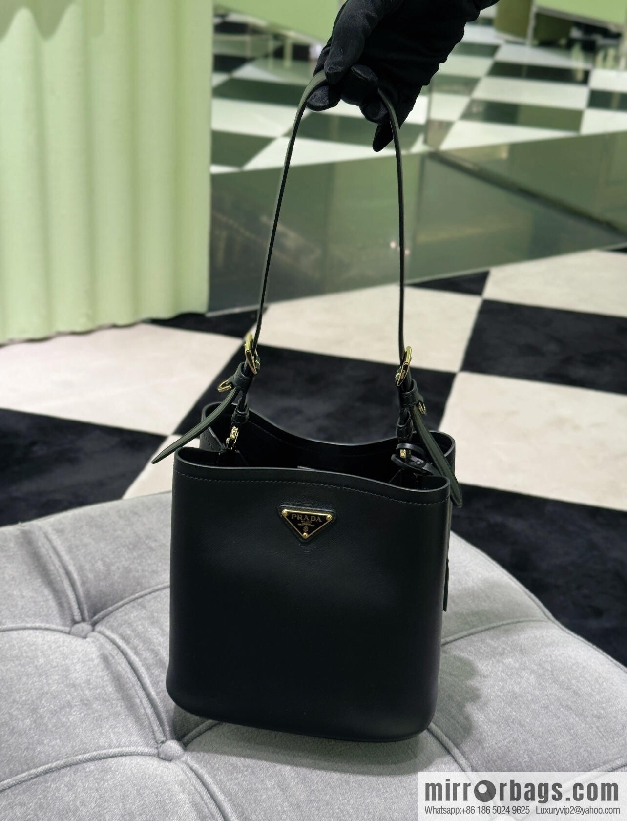 PRADA's new 1BE080 bucket bag, black.