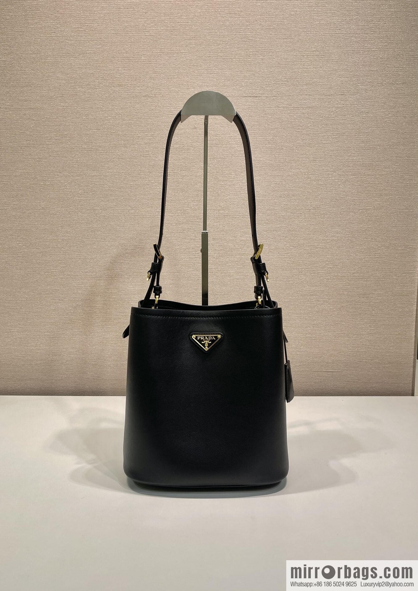 PRADA's new 1BE080 bucket bag, black.