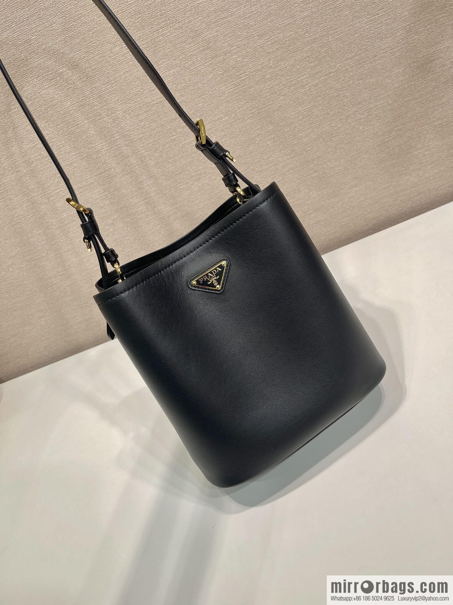 PRADA's new 1BE080 bucket bag, black.