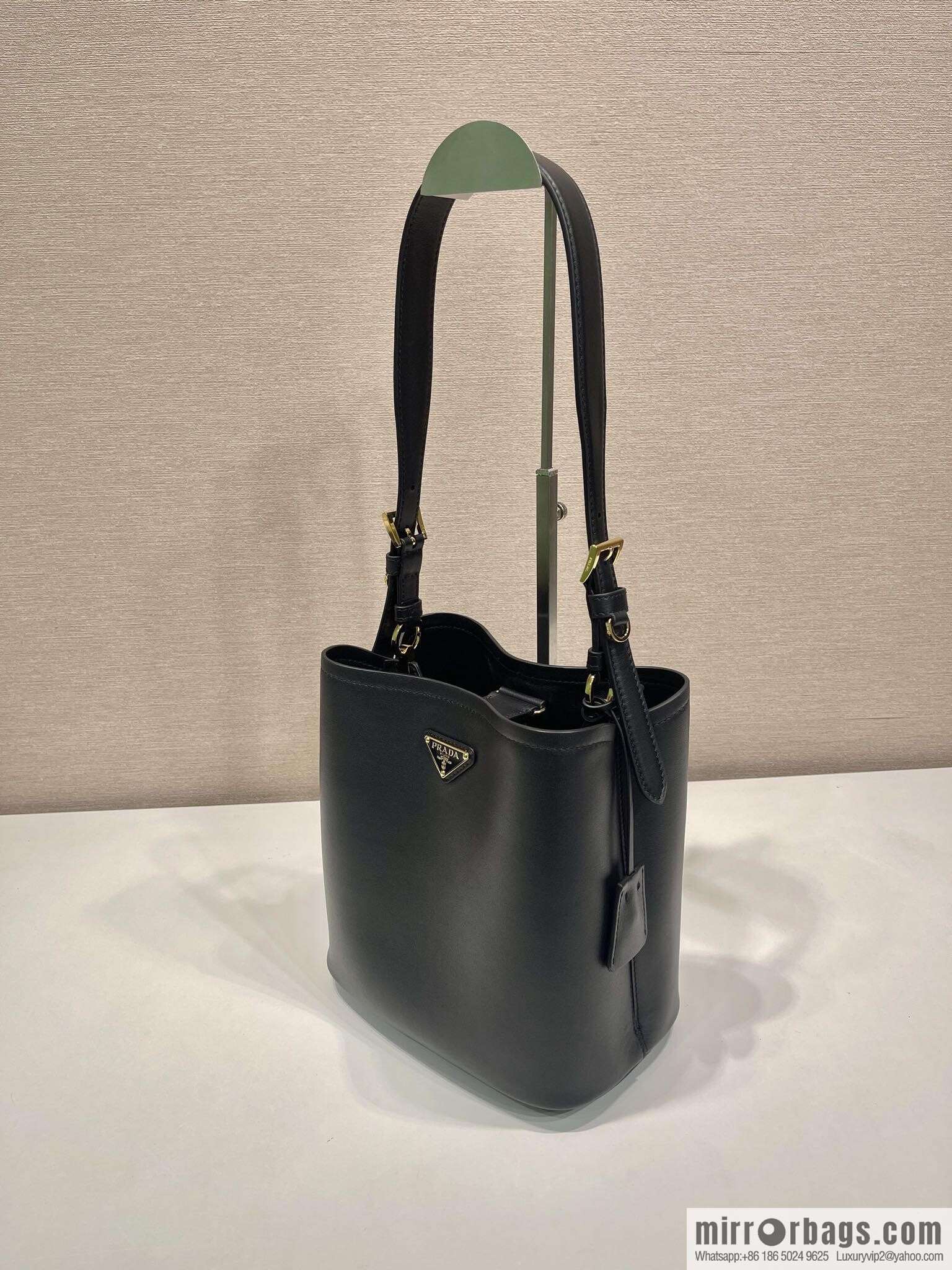 PRADA's new 1BE080 bucket bag, black.