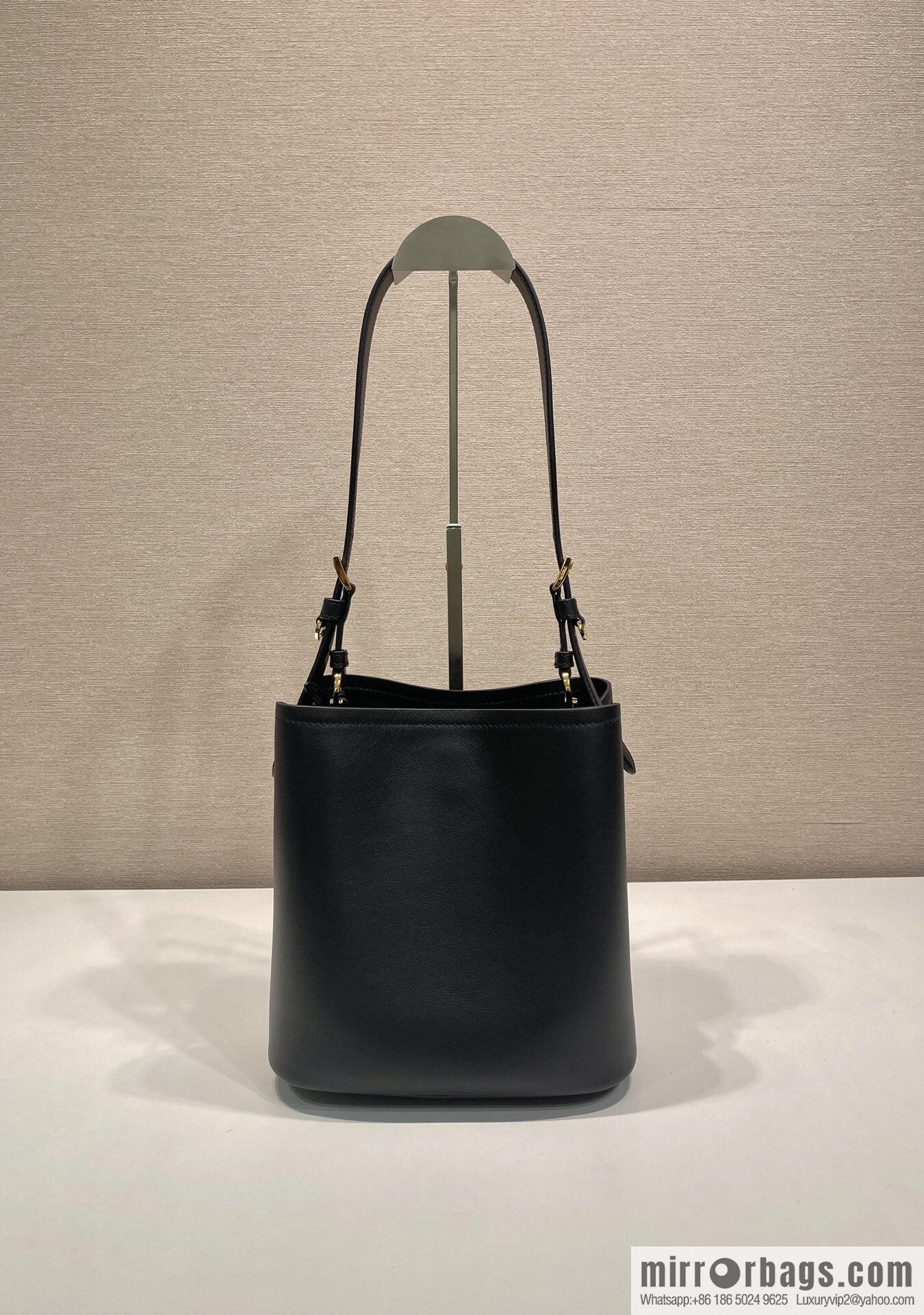 PRADA's new 1BE080 bucket bag, black.