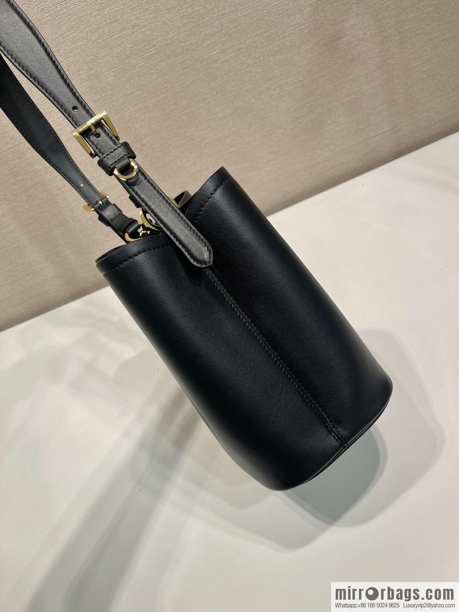 PRADA's new 1BE080 bucket bag, black.