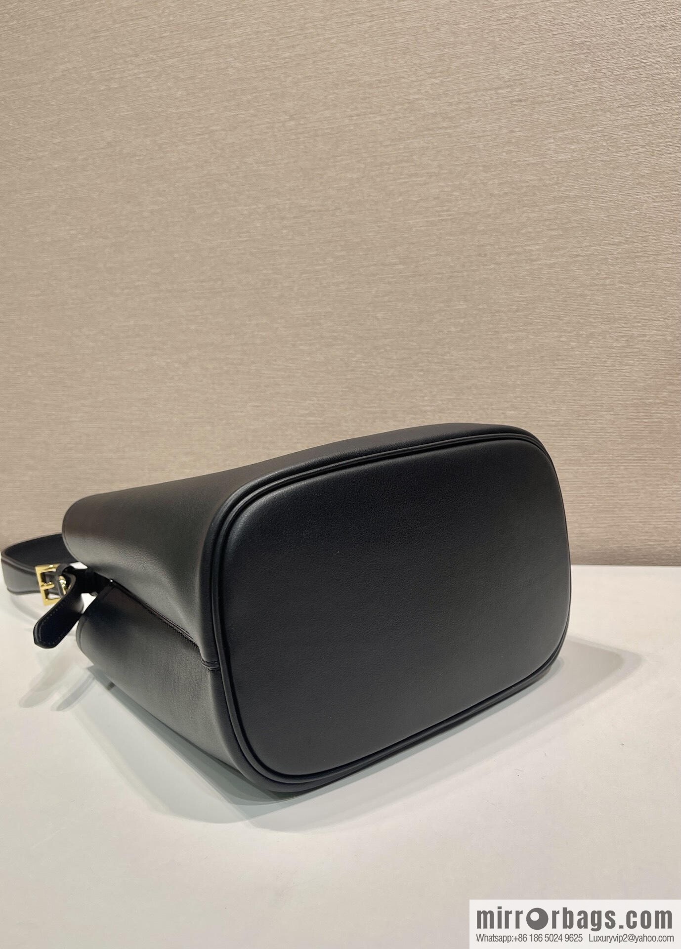 PRADA's new 1BE080 bucket bag, black.