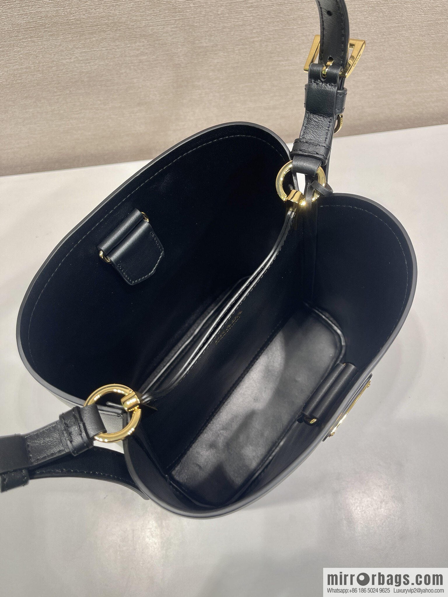 PRADA's new 1BE080 bucket bag, black.