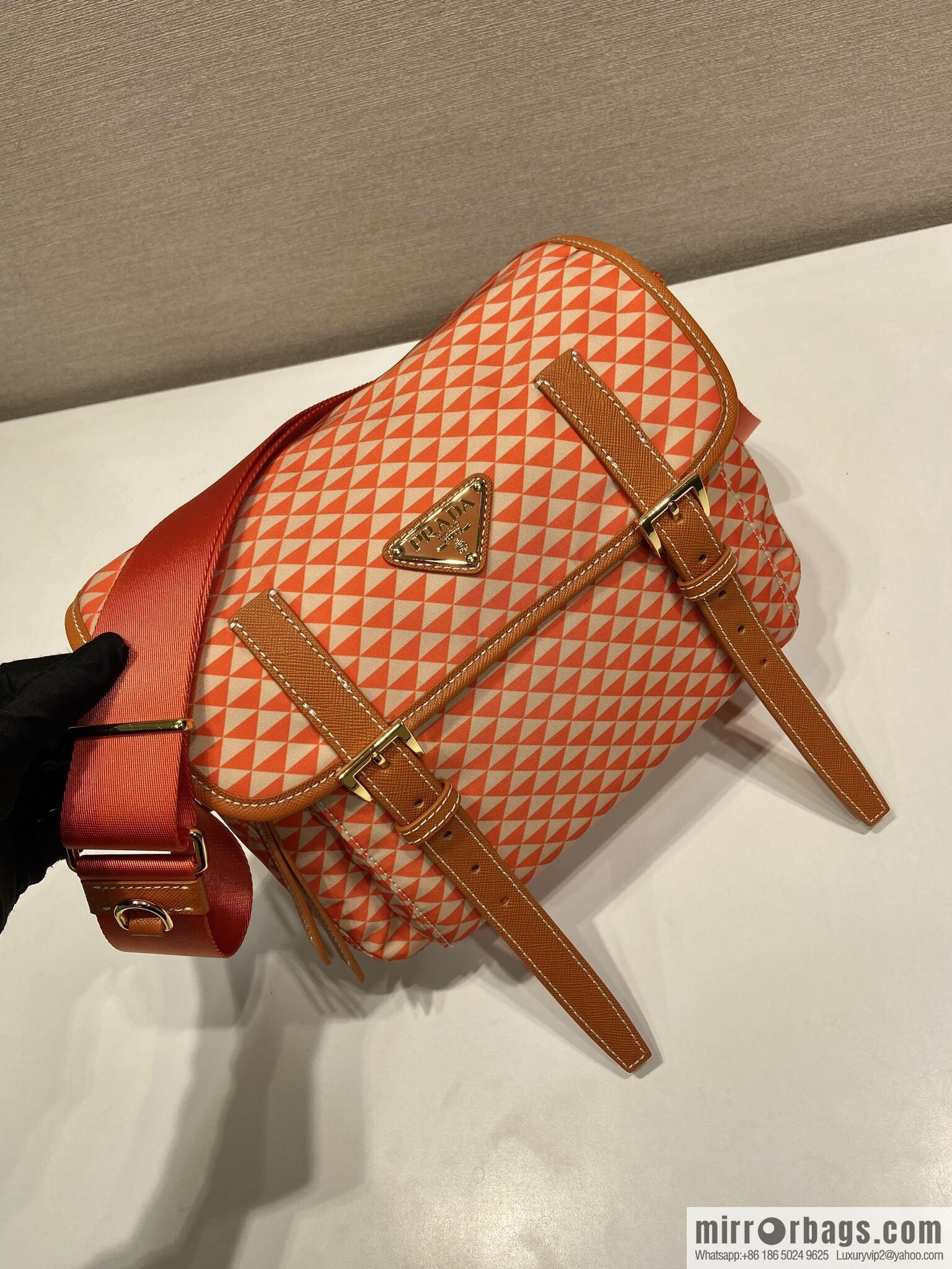 PRADA's new Symbole1BD383 messenger bag, orange