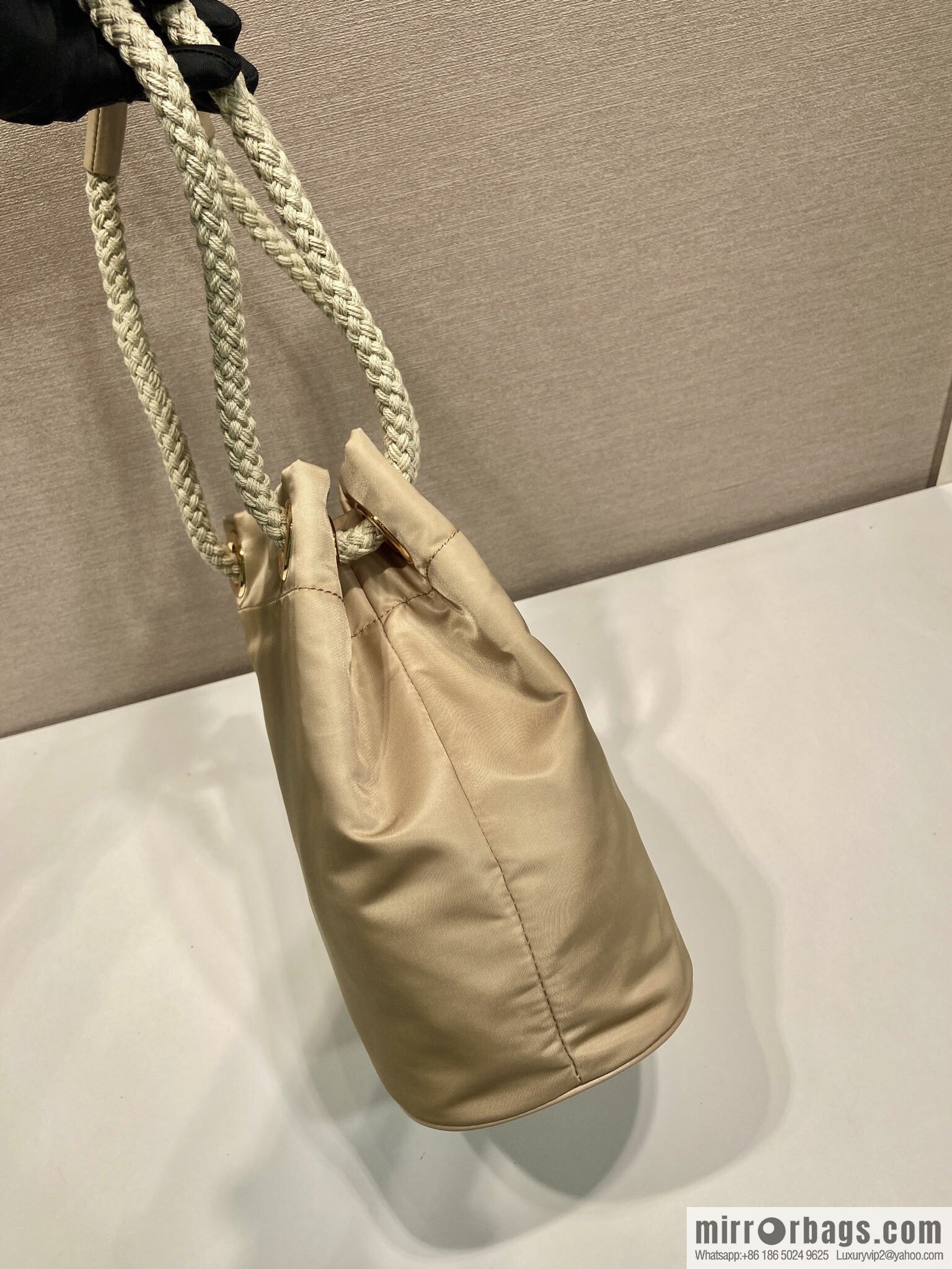 Prada's new bucket bag 1BE082 catwalk model, apricot.
