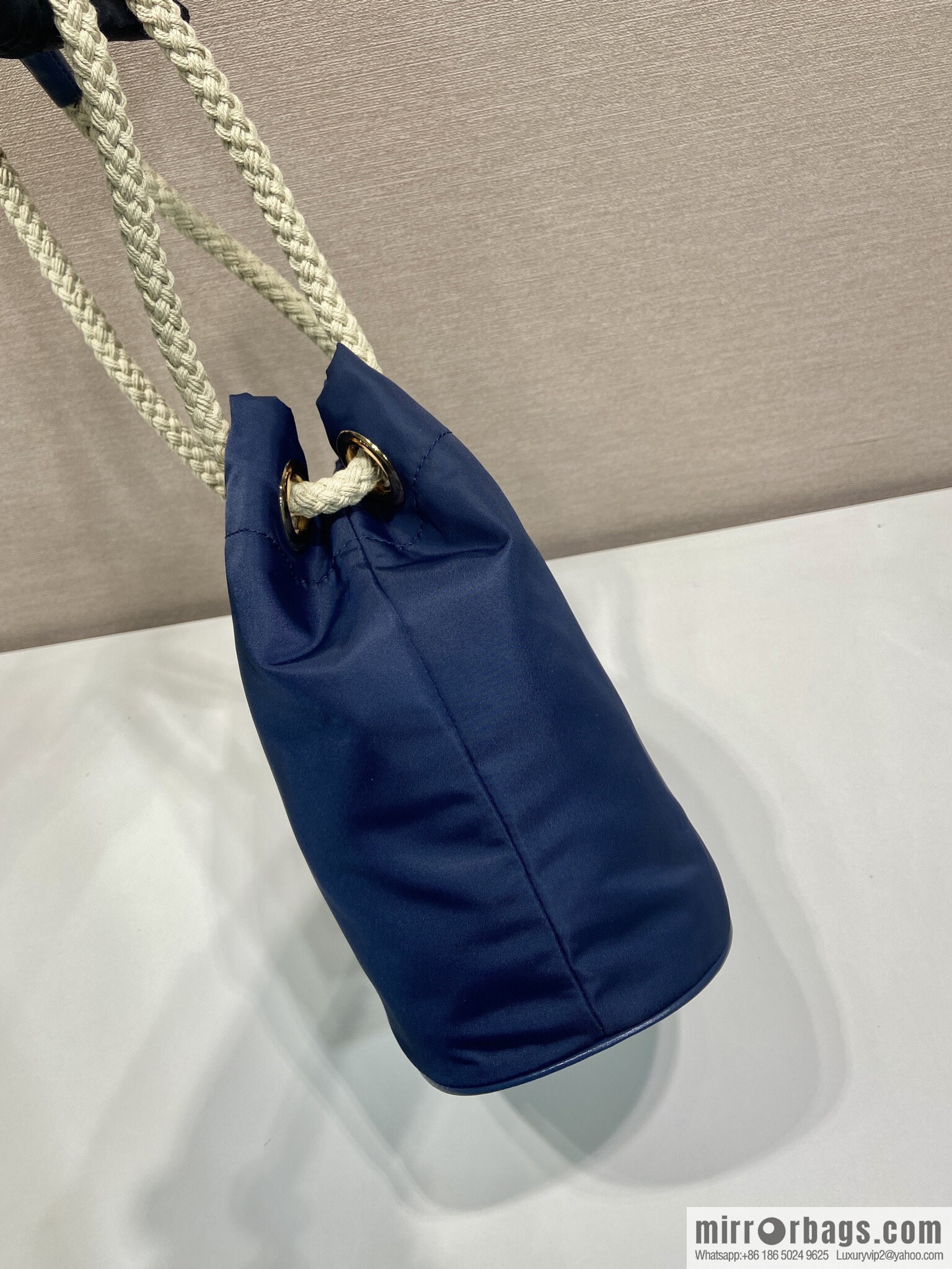 Prada's new bucket bag 1BE082 catwalk model, blue.