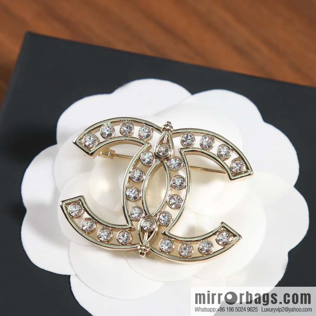 New, Chanel full diamond double c brooch.