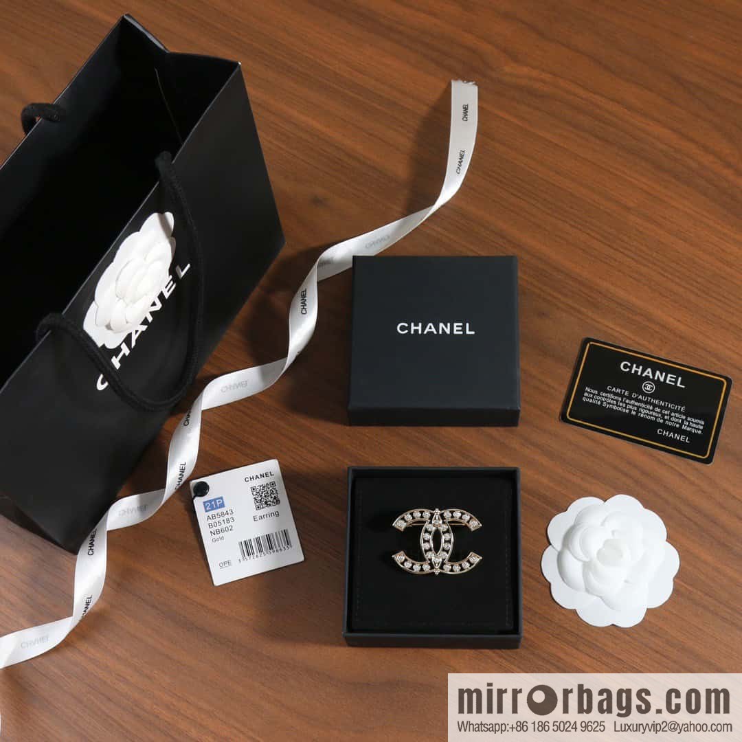 New, Chanel full diamond double c brooch.