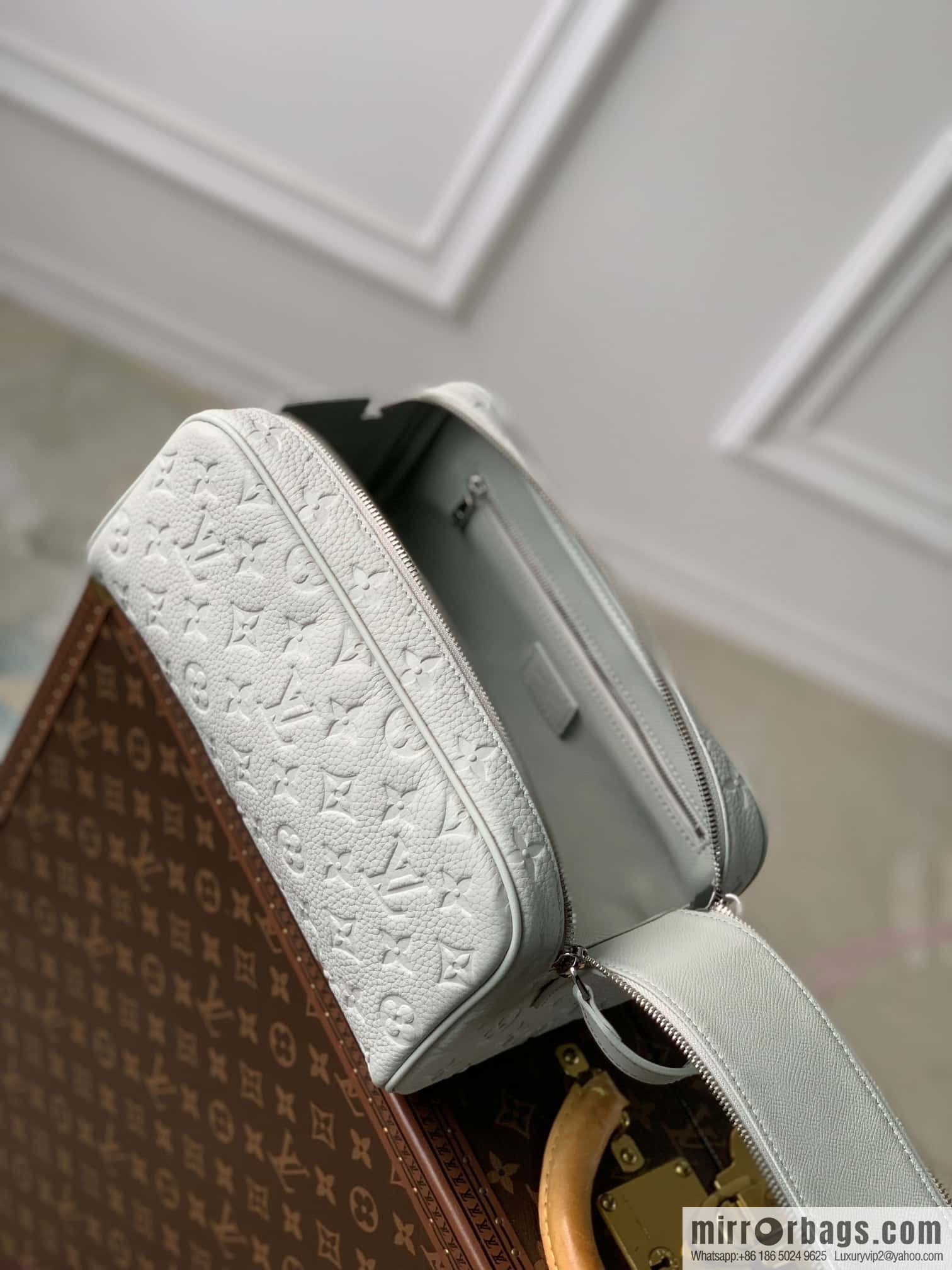 M82576 Gray and white, this Dopp Kit toilet bag.
