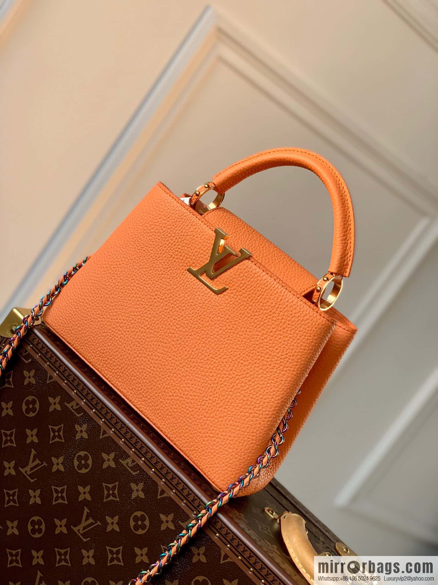 M22055 Coral Orange, Small, this Capucines Mini handbag.