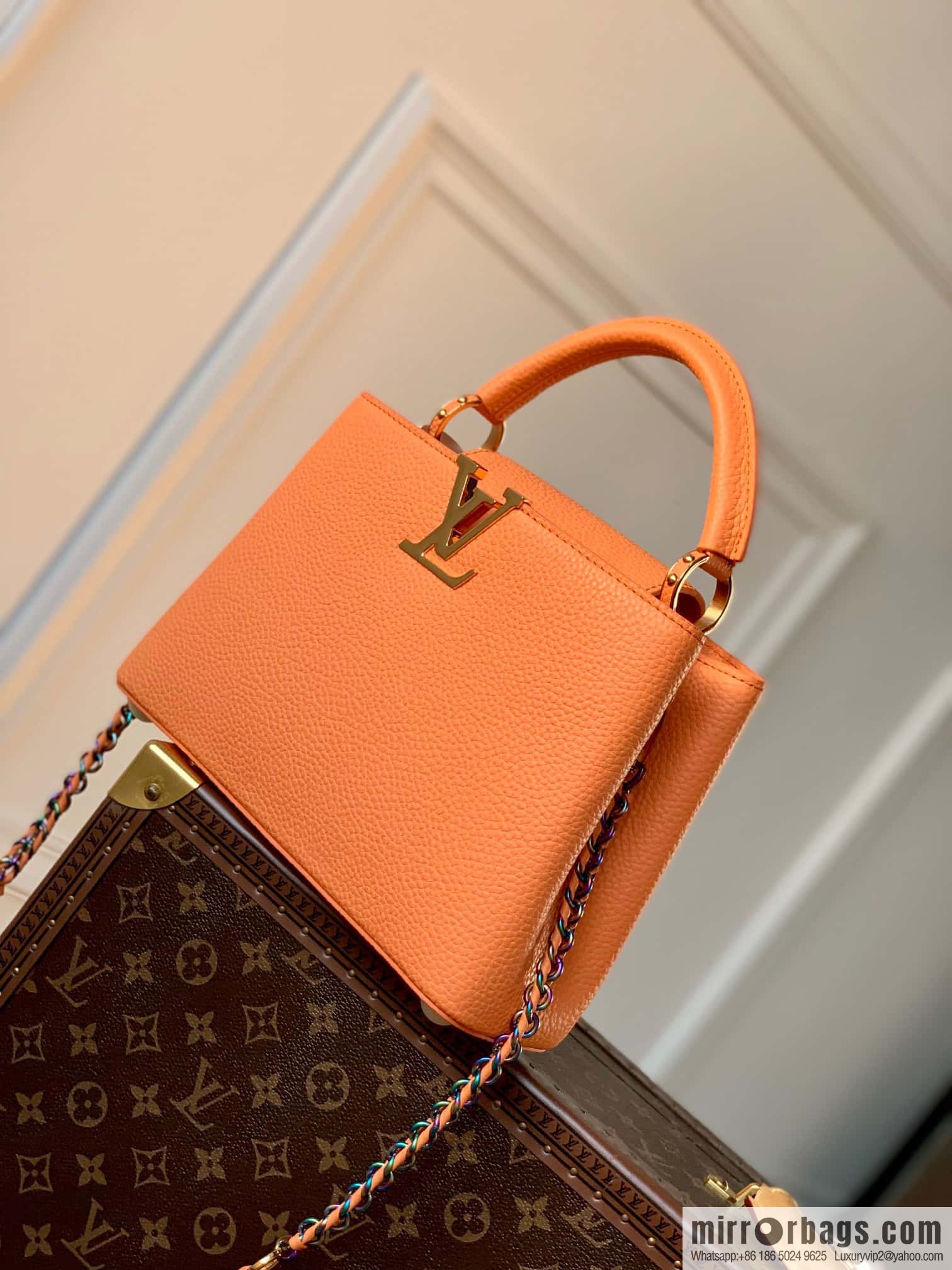 M22055 Coral Orange, Small, this Capucines Mini handbag.