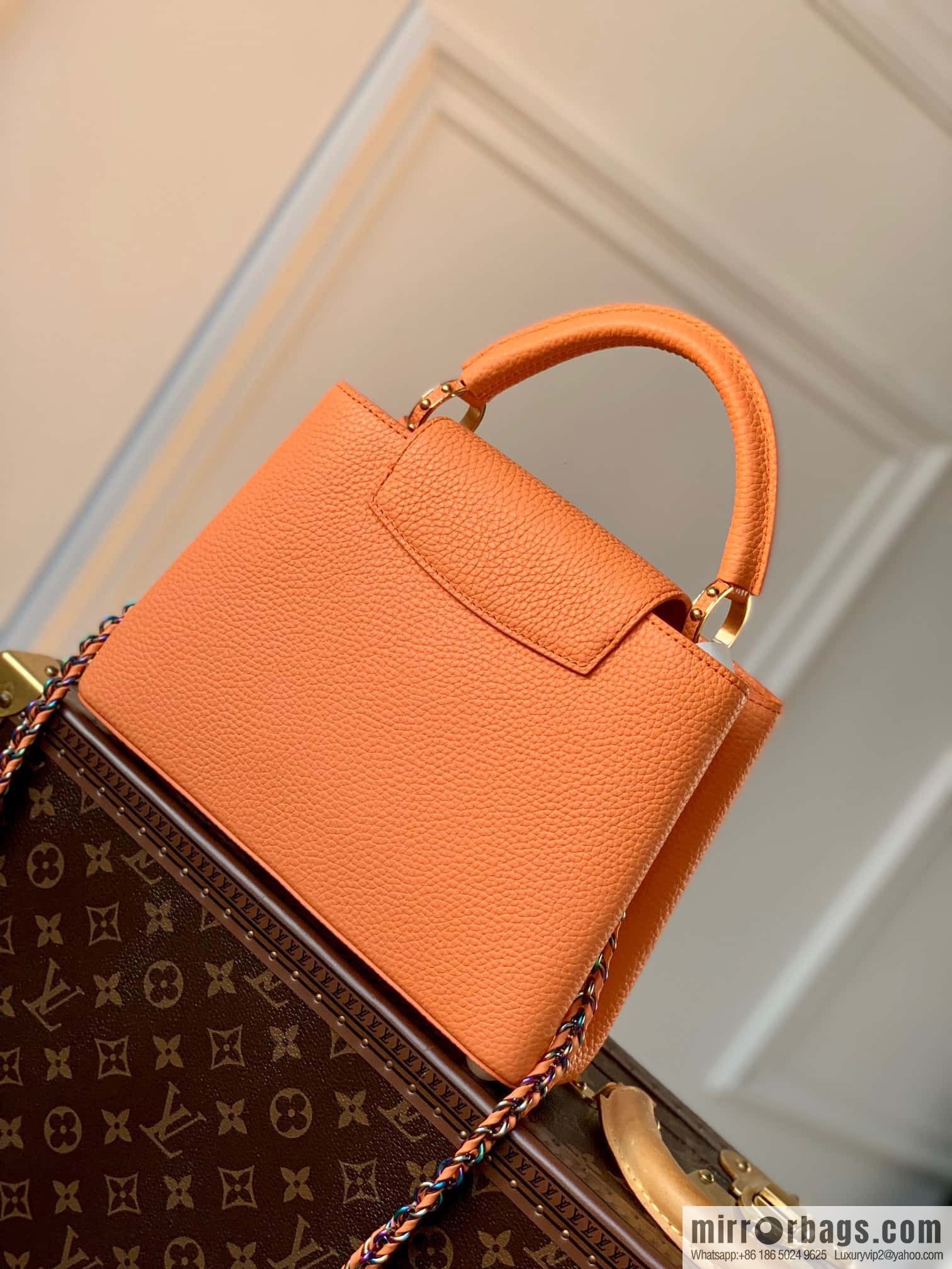 M22055 Coral Orange, Small, this Capucines Mini handbag.