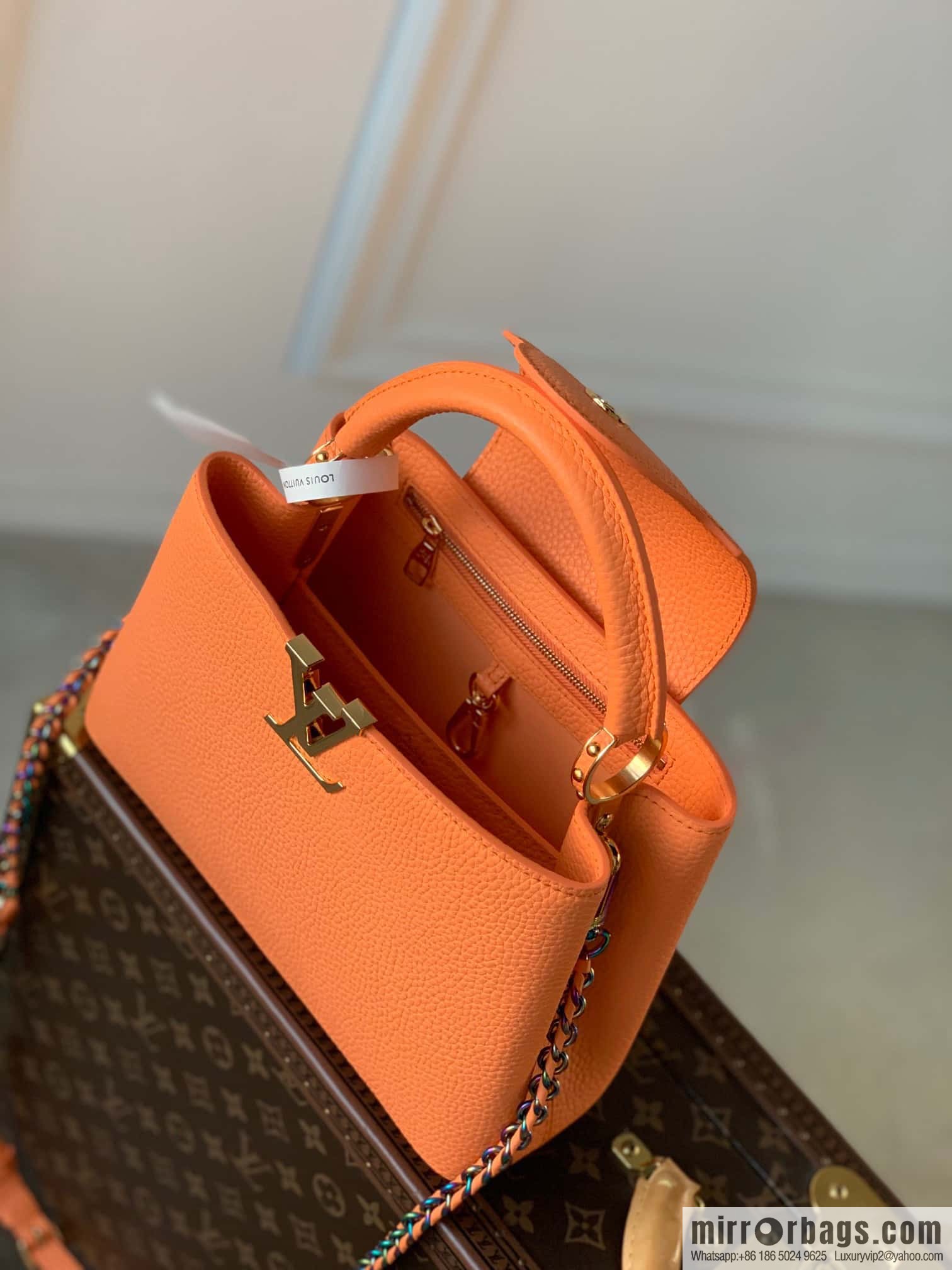 M22055 Coral Orange, Small, this Capucines Mini handbag.