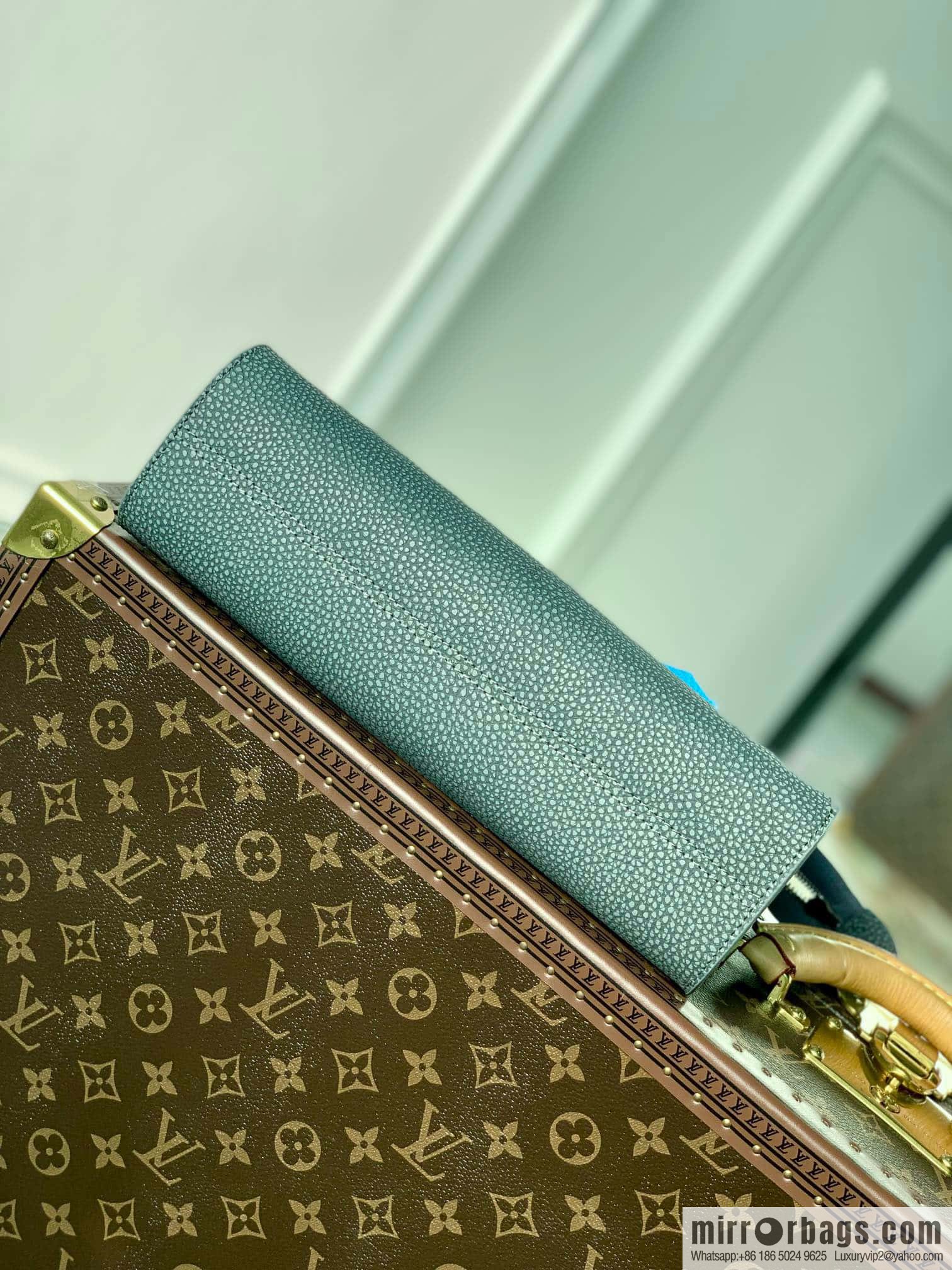 M81556 clutch bag 1934 Louis Vuitton Sac Tricot handbag