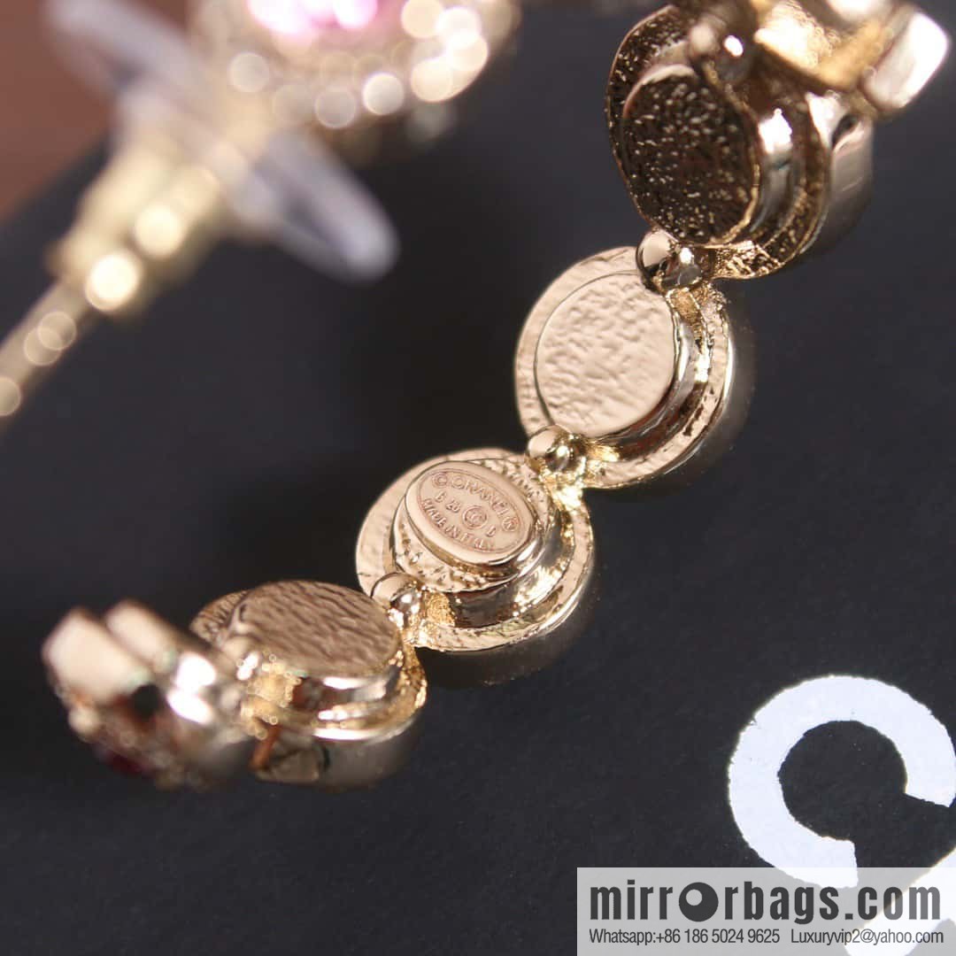 New, Chanel C1 double c semicircular pink diamond stud earrings.