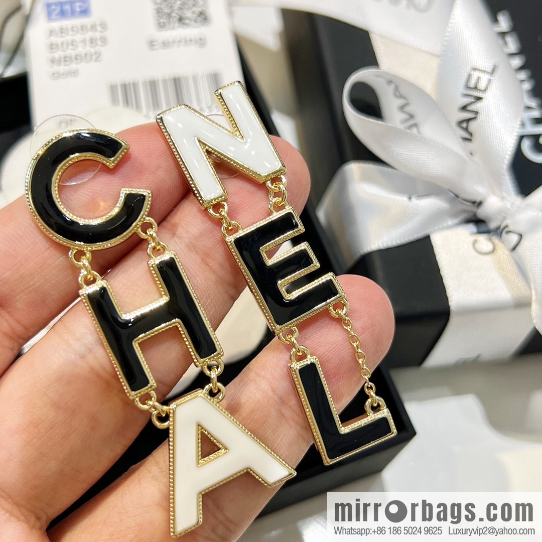 New ☑️ Chanel asymmetrical letter stud earrings