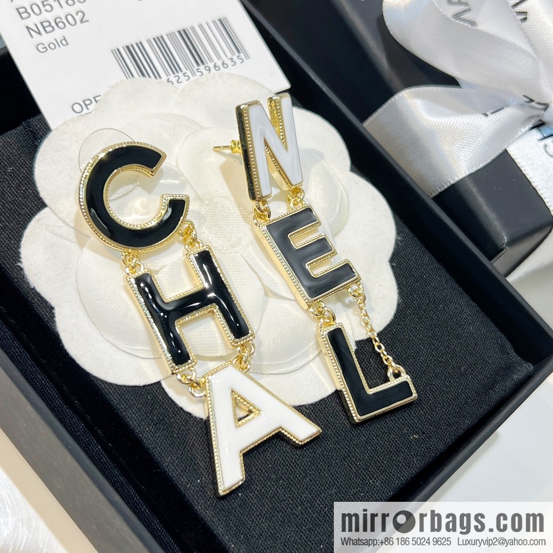 New ☑️ Chanel asymmetrical letter stud earrings