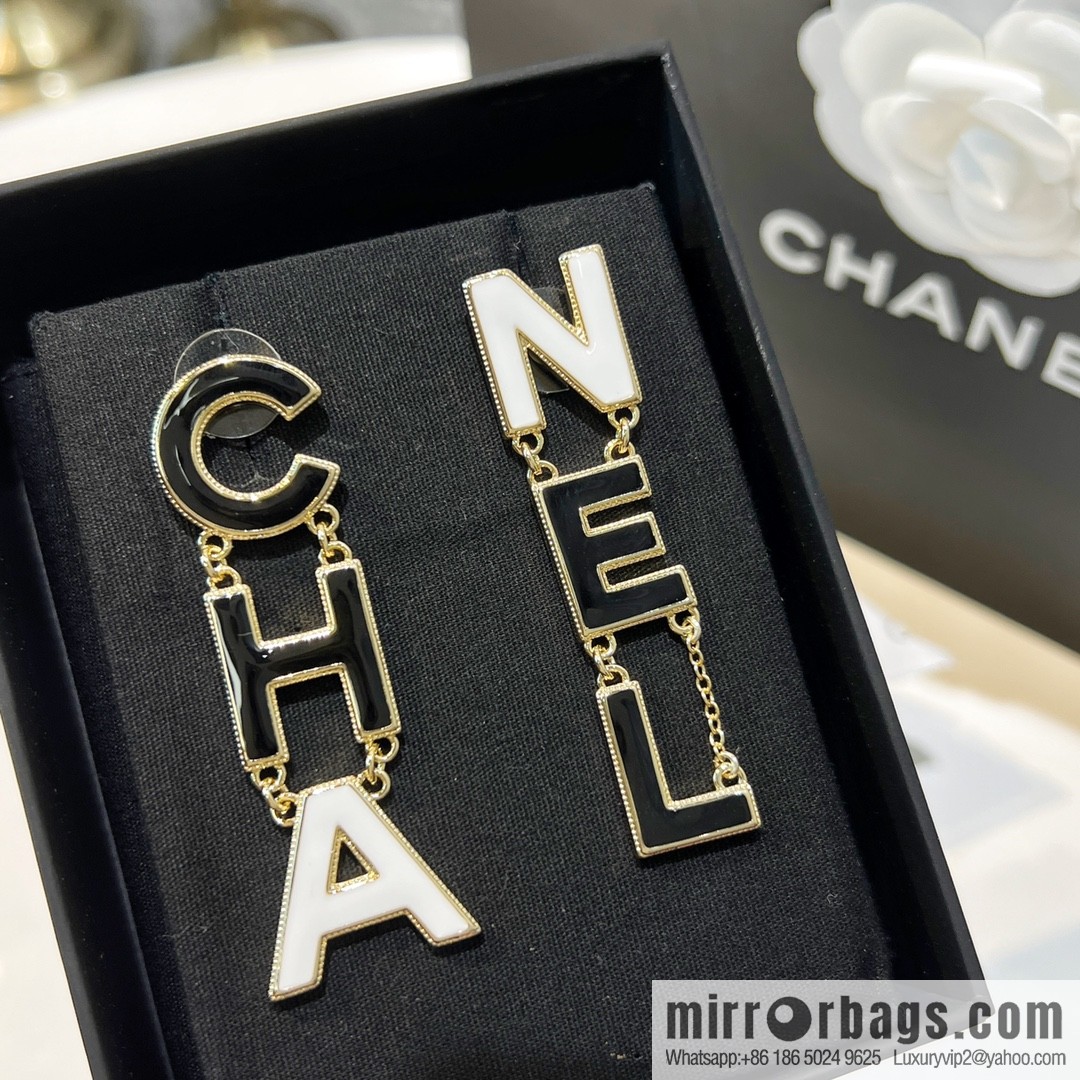 New ☑️ Chanel asymmetrical letter stud earrings