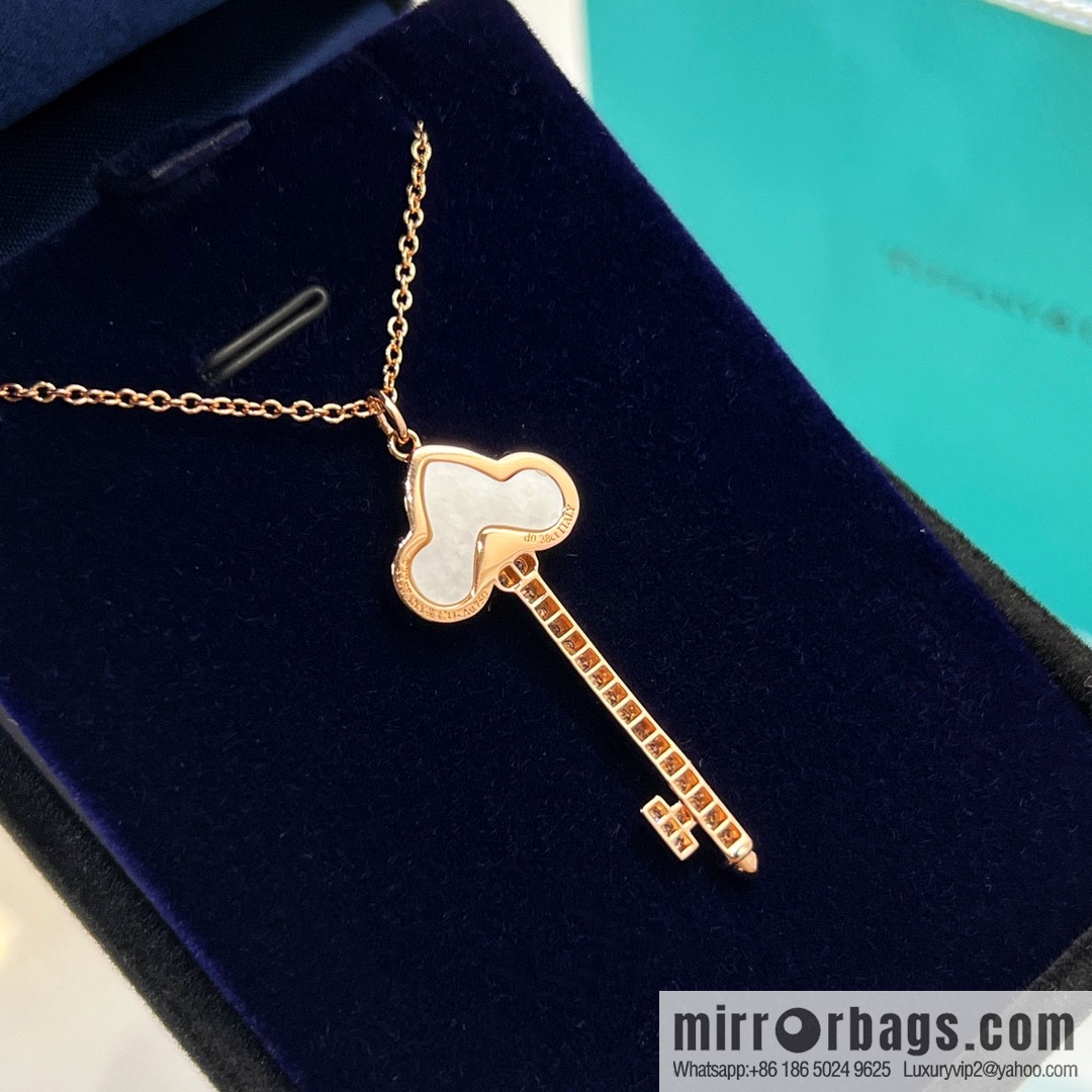 TIFFANY & CO. Tiffany & Co. Fleur de Lis white shell key pendant necklace