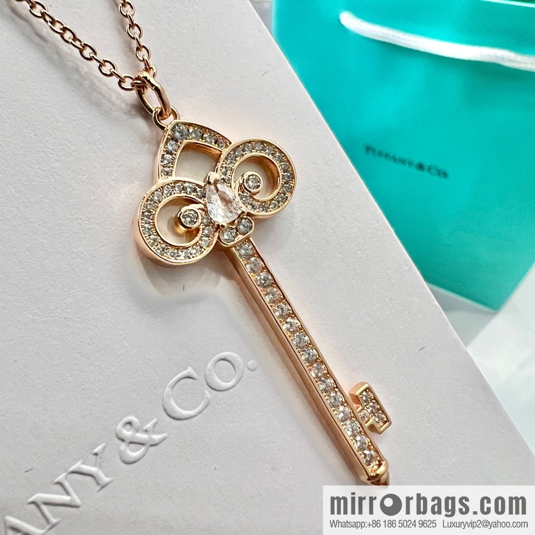 TIFFANY & CO. Tiffany & Co. Fleur de Lis white shell key pendant necklace
