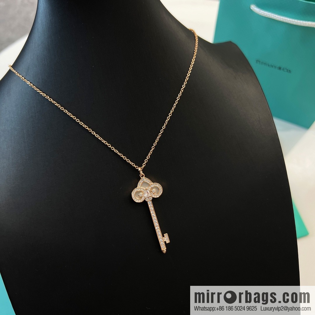 TIFFANY & CO. Tiffany & Co. Fleur de Lis white shell key pendant necklace