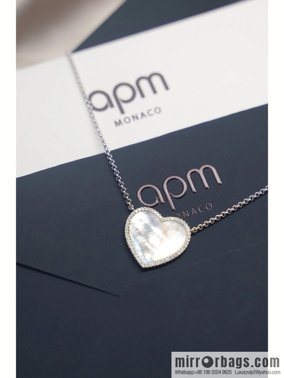 APM Monaco white mother shell love necklace adjustable