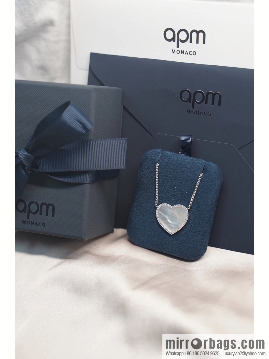 APM Monaco white mother shell love necklace adjustable