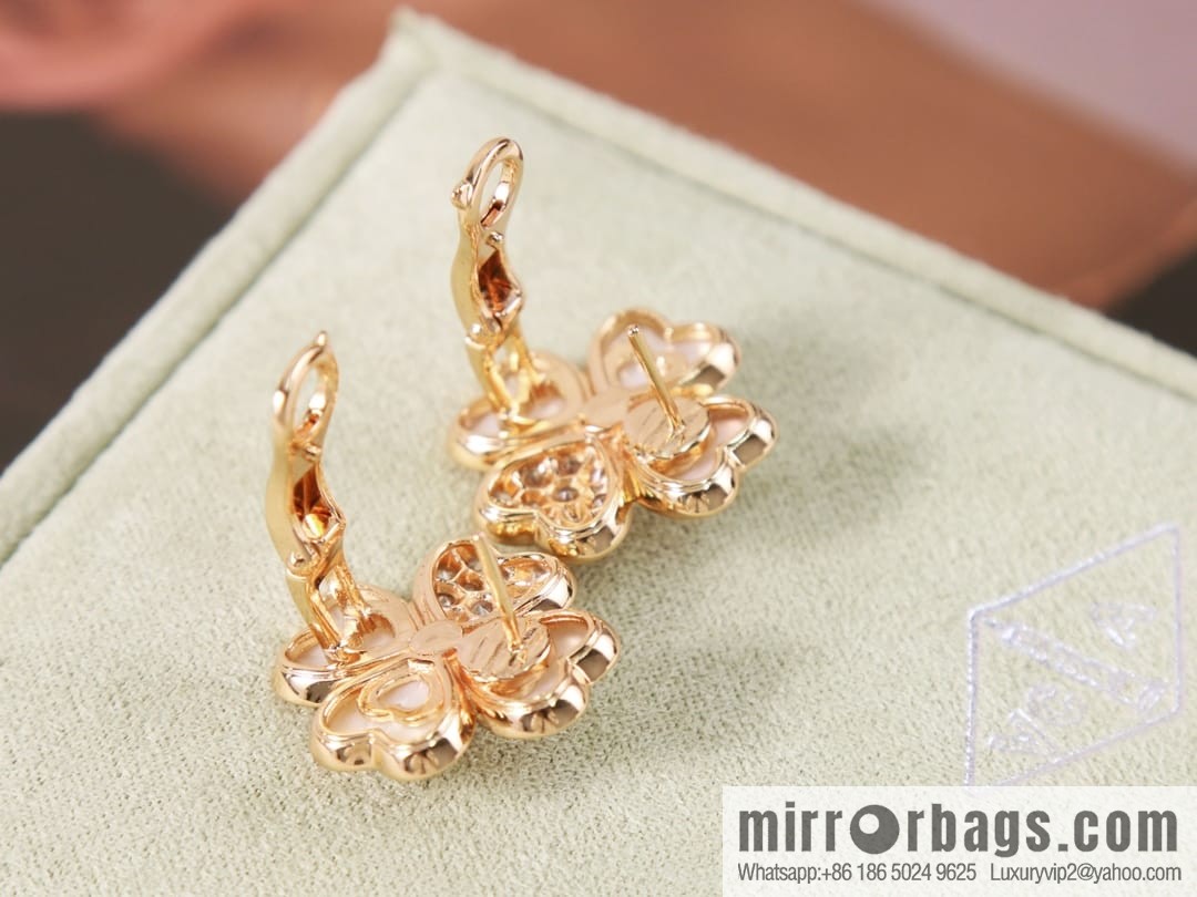 Van Cleef & Arpels cosmos four-leaf clover fritillary earshot