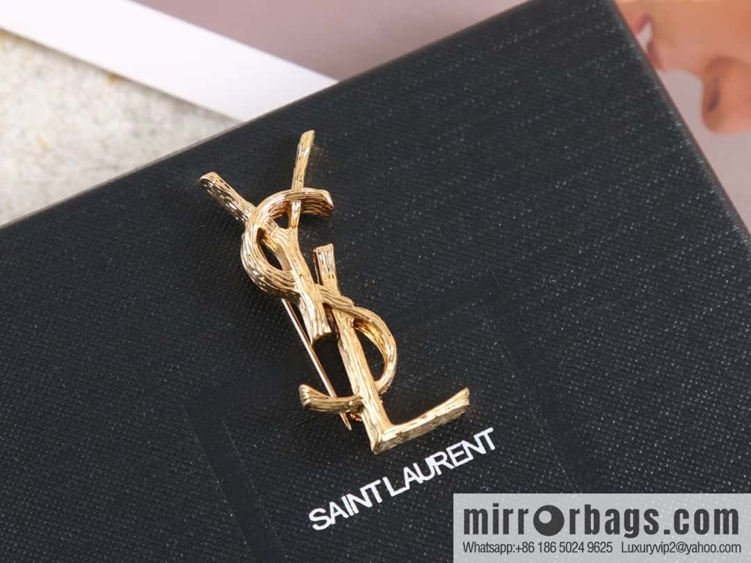 Saint Laurent gold YSL brooch
