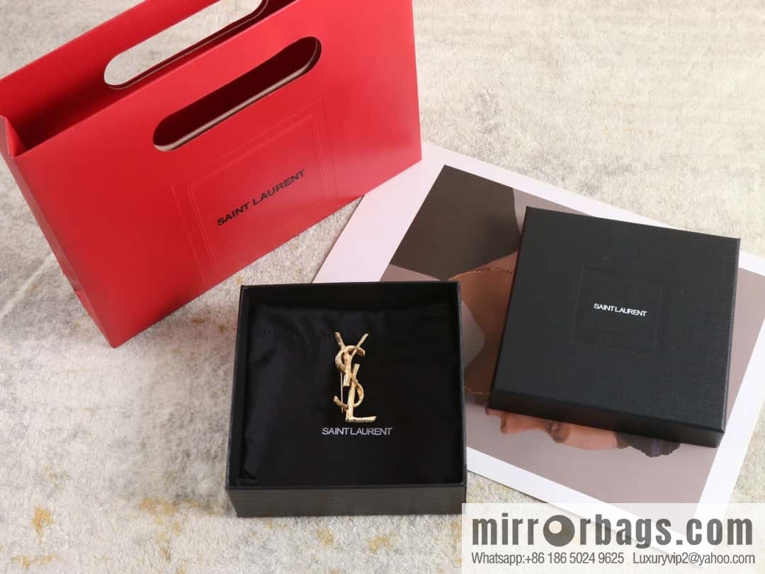 Saint Laurent gold YSL brooch