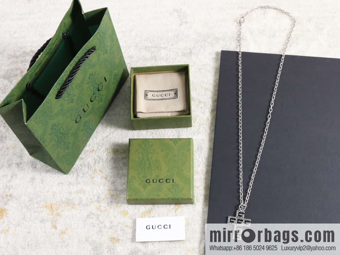 Gucci cross cut-out double G necklace