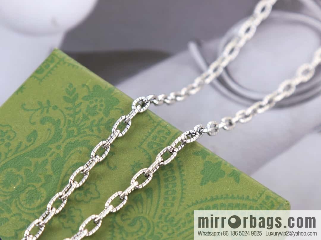 Gucci cross cut-out double G necklace