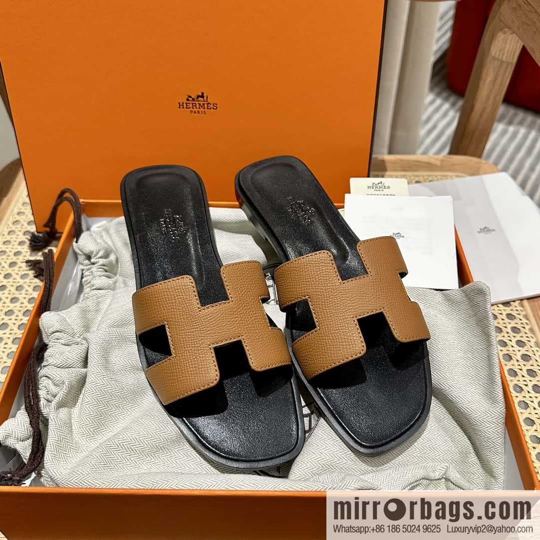 Hermès leather outsole H slippers, black and brown.