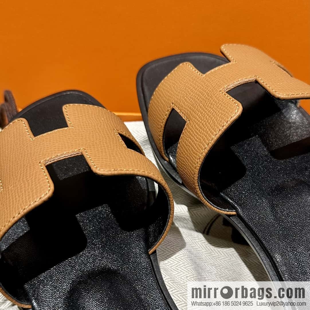 Hermès leather outsole H slippers, black and brown.