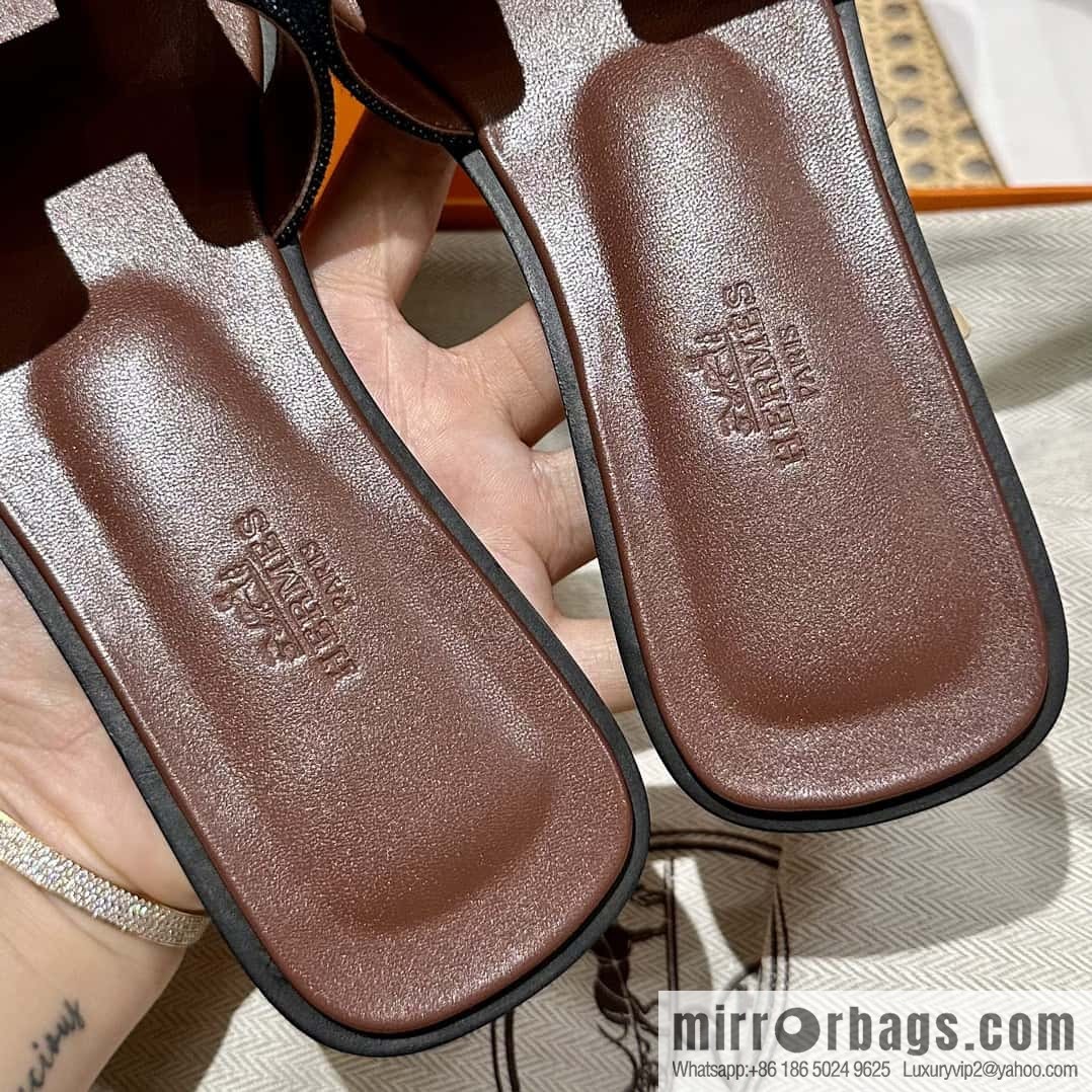 Hermès leather outsole H slippers, dark brown and black.