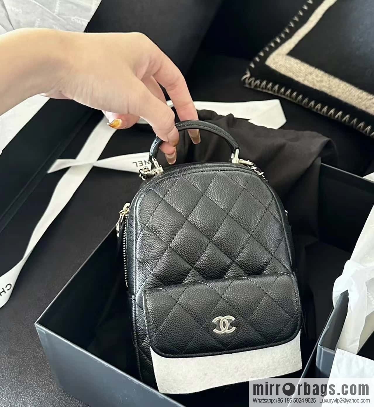 CHANEL 24C early spring vacation series, lychee leather backpack AP3753 black