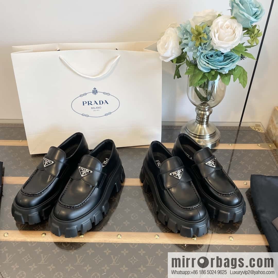 PRADA Prada, triangular label, serrated wheel muffin platform loafers 1D246M