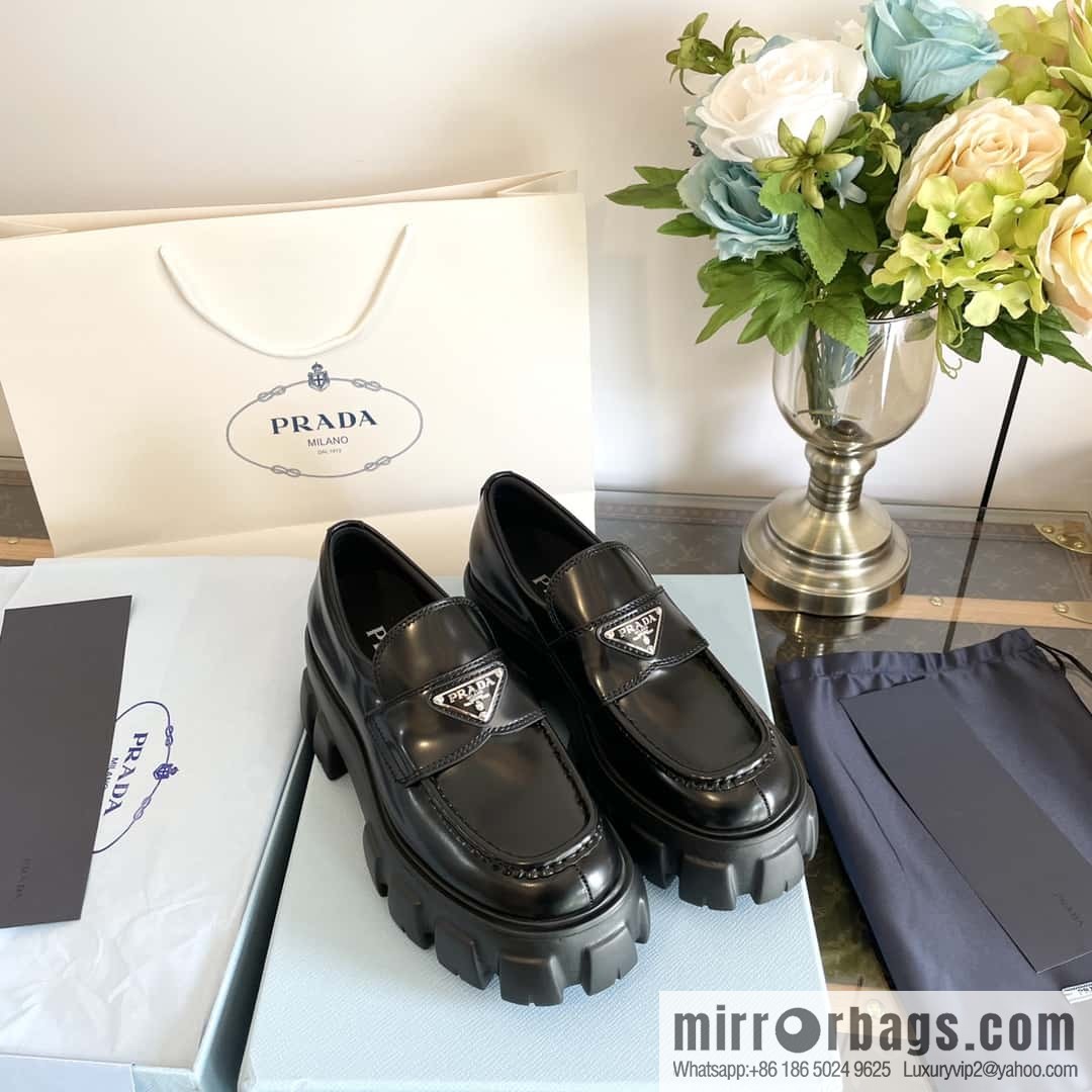 PRADA Prada, triangular label, serrated wheel muffin platform loafers 1D246M