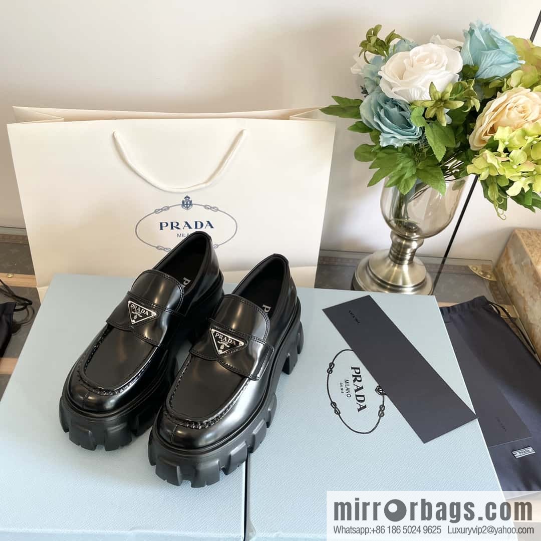 PRADA Prada, triangular label, serrated wheel muffin platform loafers 1D246M