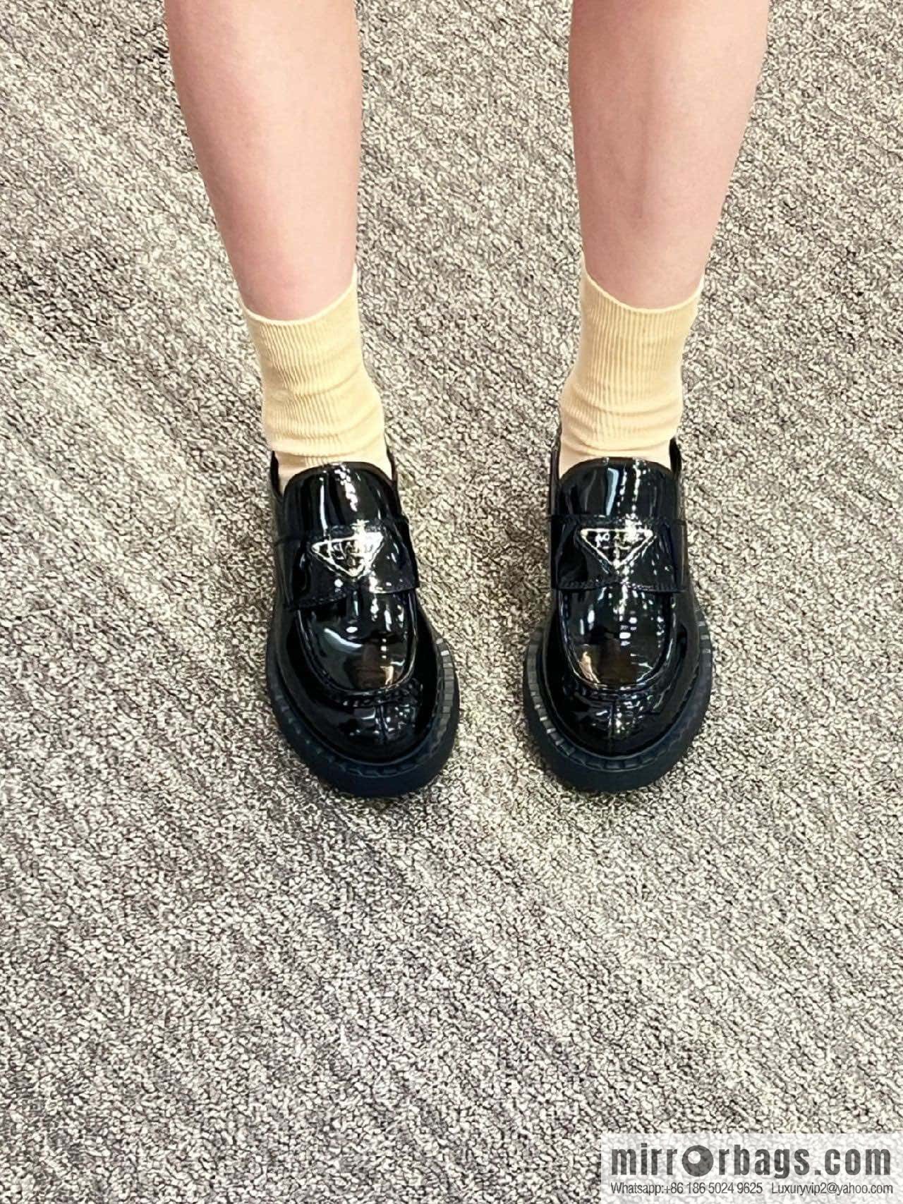 Prada, Puhada glossy patent leather triangle loafers