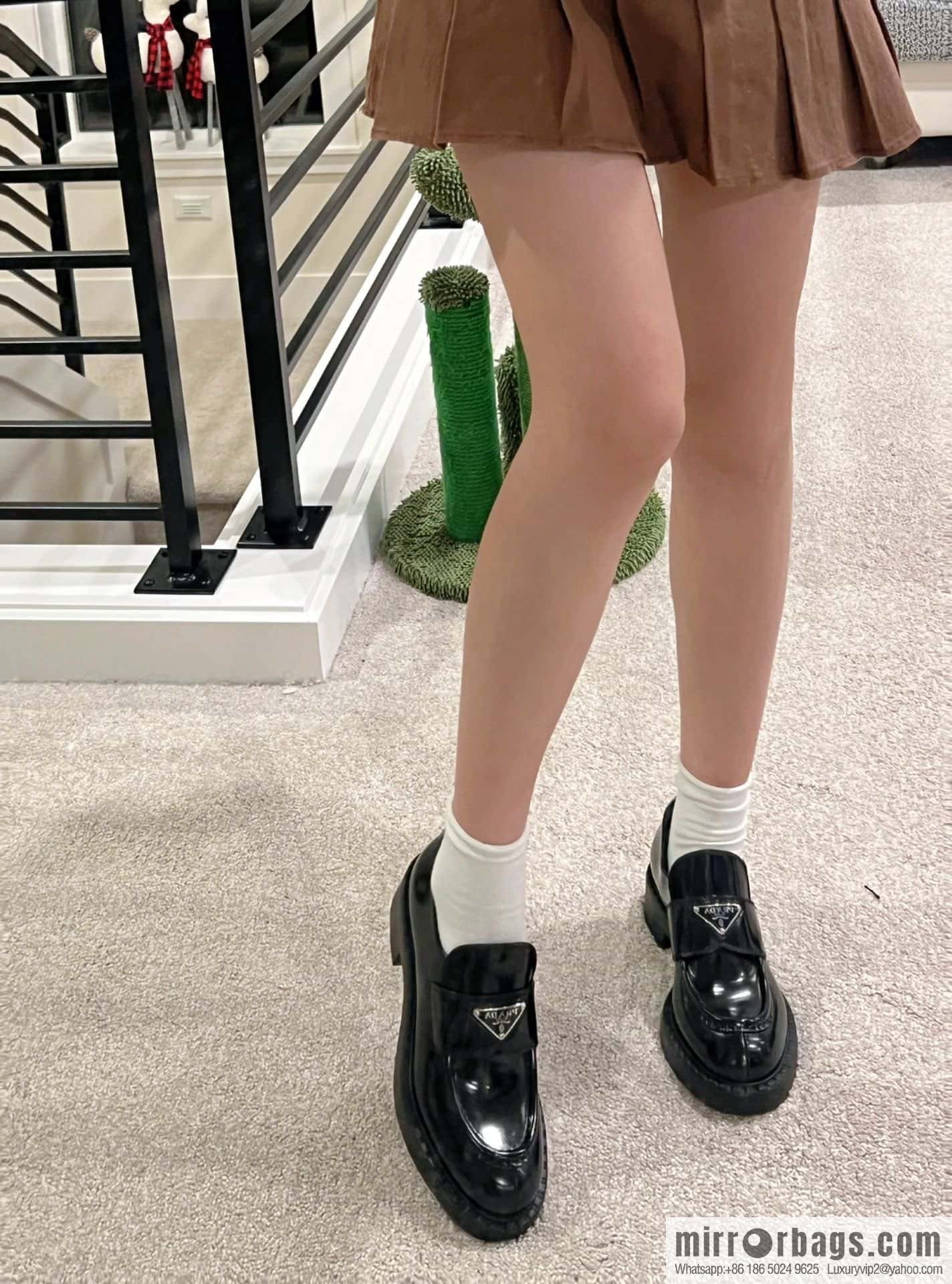 Prada, Puhada glossy patent leather triangle loafers