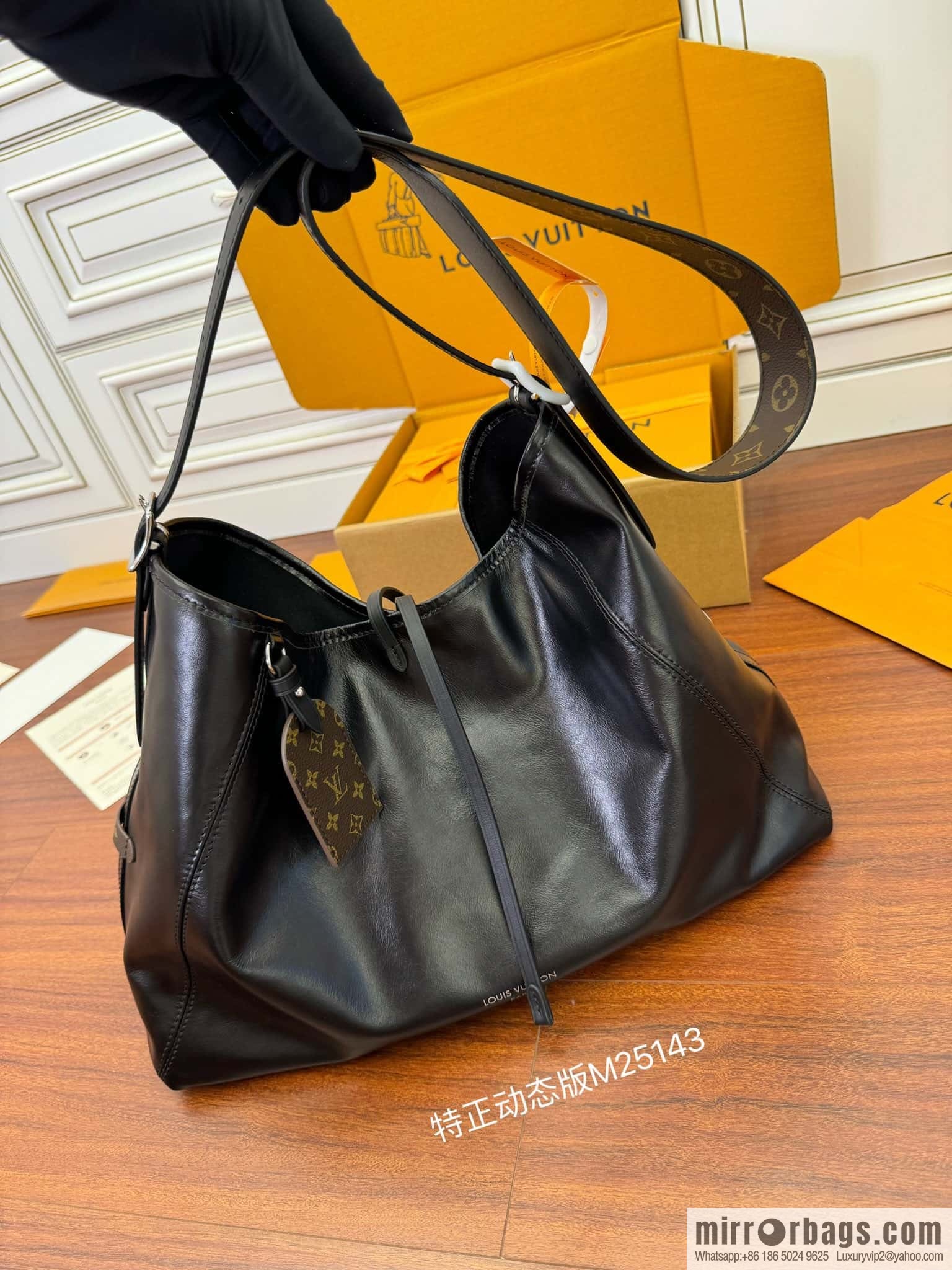 LV M25143 New CARRYALL DARK medium handbag of the season