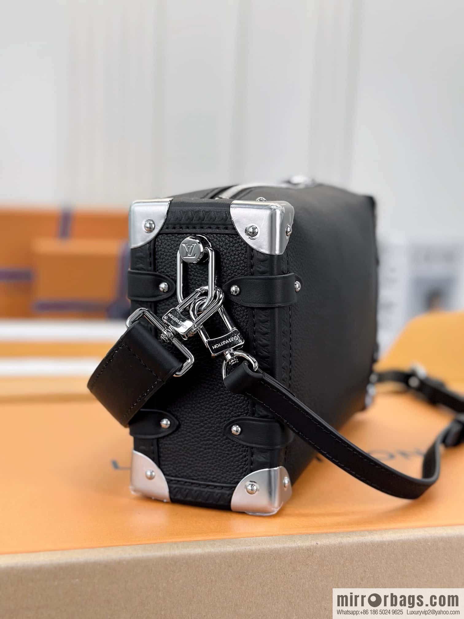 LV M25160 SIDE TRUNK medium handbag