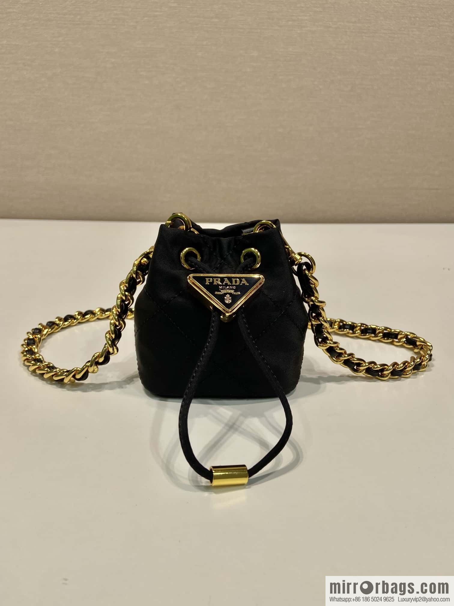 PRADA 🎉 embroidered grid small bucket 🎉 1NR016