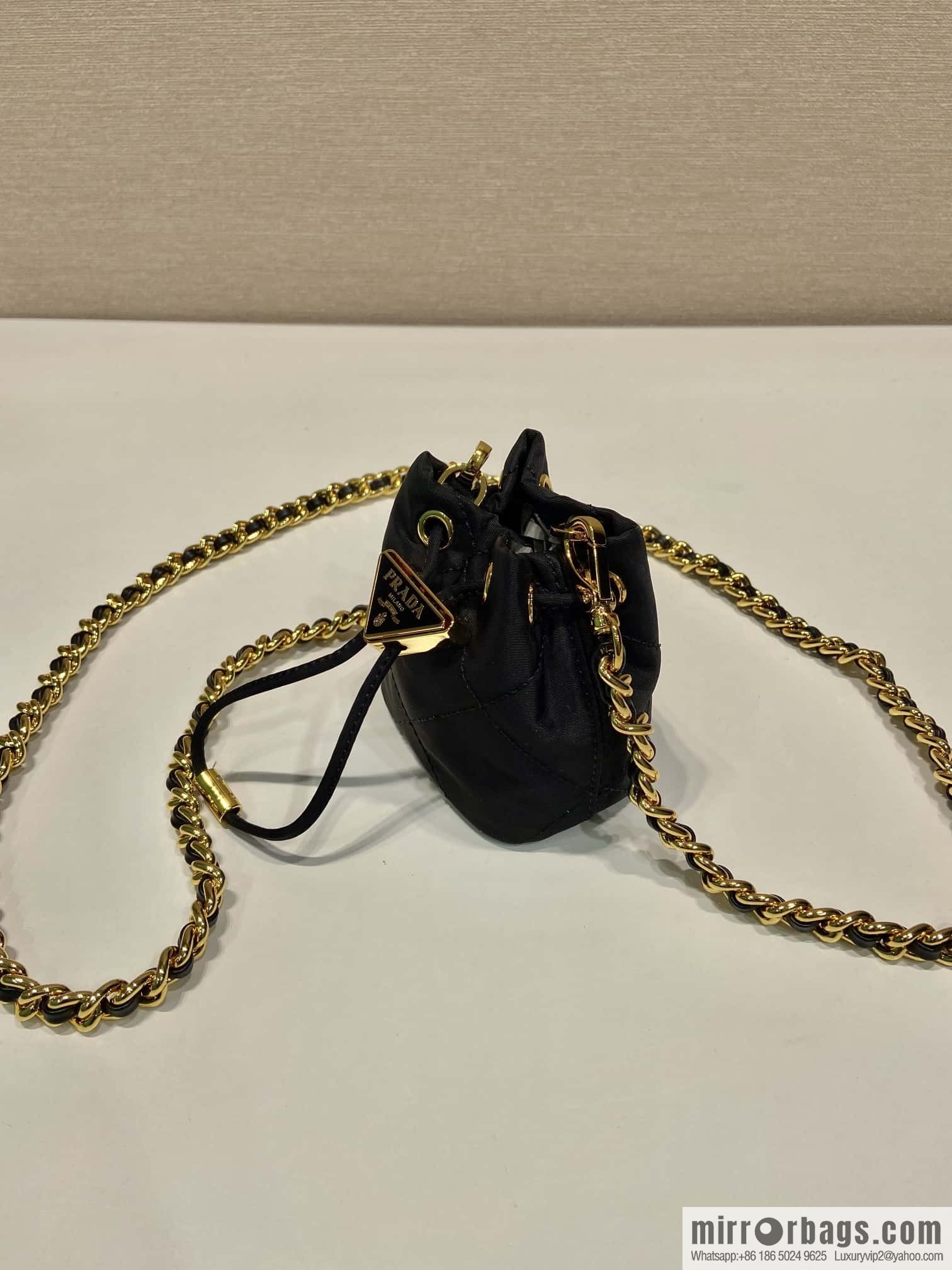 PRADA 🎉 embroidered grid small bucket 🎉 1NR016