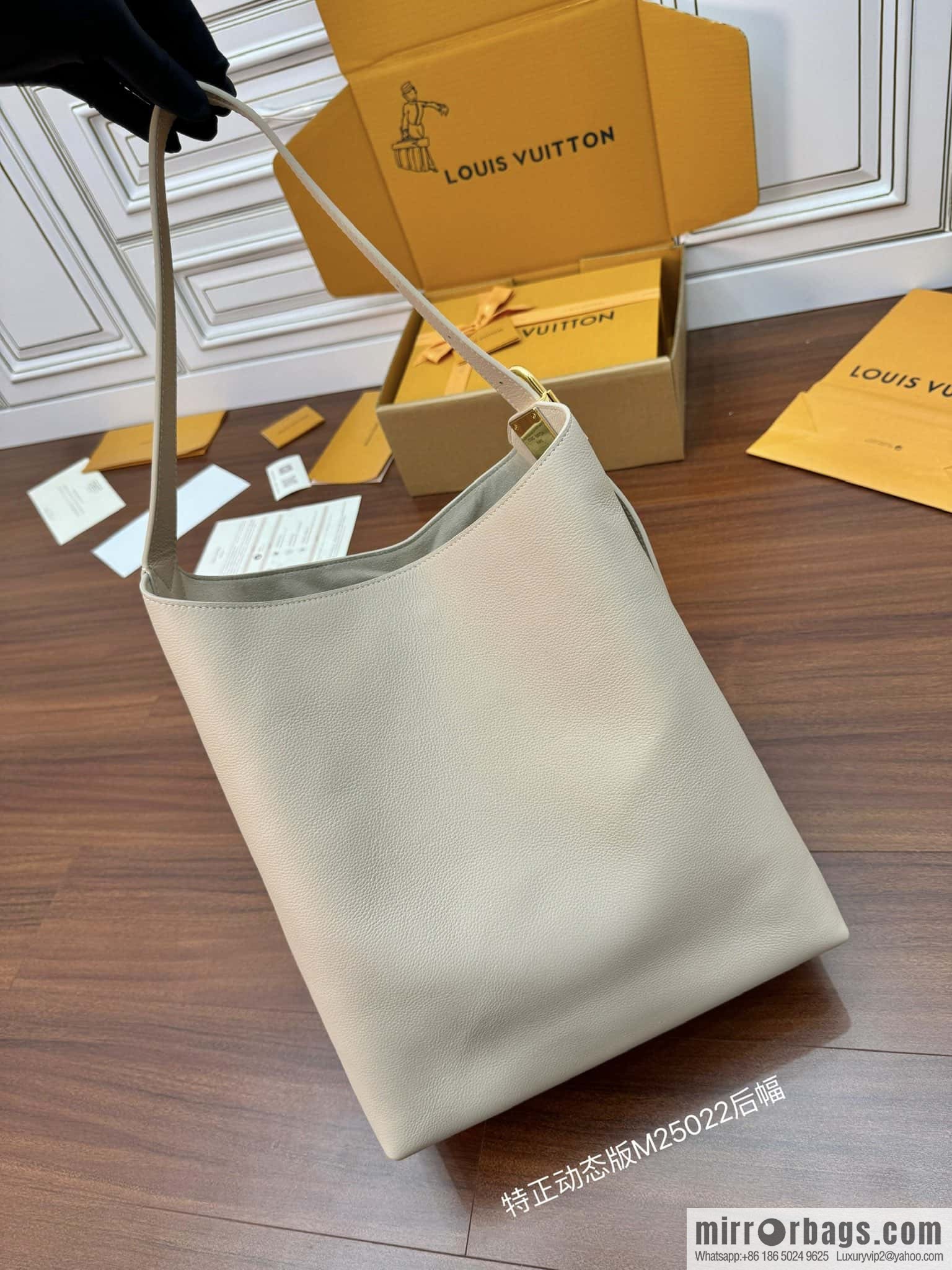 LV M25022 LOW KEY HOBO medium handbag